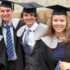 A group of graduates walking together who are now alumni
