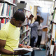 A student reading a book in the Drill Hall library