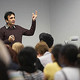 A peaker giving a talk in a room full of students