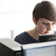 A woman working in administration at the Medway campus
